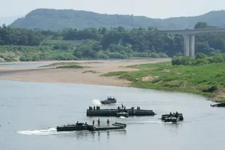 US army soldiers conduct a training exercise on a river in Yeoncheon, South Korea, near the border with North Korea, on Tuesday.