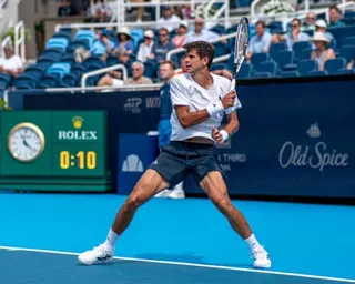 Rafael Jódar lunges to hit a backhand shot during his match at the Cincinnati Open