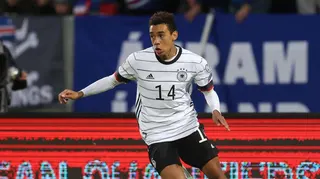 Jamal Musiala runs with the ball for Germany against Iceland in 2021
