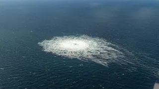 A gas leak in seen in blue waters
