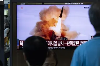 People in Seoul watch a news broadcast on August 12 showing a North Korean missile launch. Japan says it detected a suspected North Korean missile launch off the country's east coast on Thursday. Photo: EPA