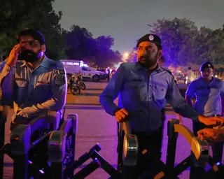 Police officers on guard on Thursday at a barricaded road near the Shifa international hospital