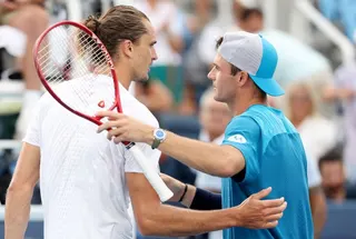 Tommy Paul, right, hugs Alexander Zverev after their fourth-round match