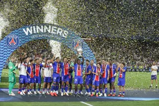 PSG's players lift the trophy during celebrations at the end of the UEFA Super Cup soccer match between Paris Saint-Germain and Aston Villa