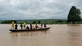 People travel by a boat as search and rescue operations continue following a boat accident, in a place given as Sokoto State, Nigeria, in this handout image released on August 17, 2025.