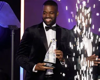 Leon Baptiste receives the 'England Athletics Coach of then Year' award in 2023