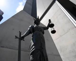 A statue of Themis, the Greek God of Justice, stands outside the Supreme Court in Brisbane.