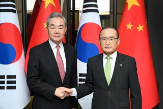 South Korean National Security Adviser Wi Sung-lac (right) shakes hands with Chinese Foreign Minister Wang Yi during their meeting in Seoul, on Aug 20.