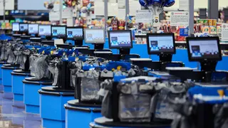 Empty checkout lanes inside a Walmart store in Columbus, Ohio, on Black Friday.