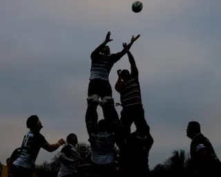 Rugby players compete for a lineout