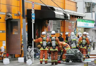 Japanese firemen work at the scene of a fire at a slot machine parlor in Osaka, western Japan, on July 5, 2009. Japan today executed a man convicted of an arson attack on a pachinko parlour in 2009 that killed five people, authorities said. — Jiji Press/AFP pic