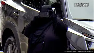 The woman in all black taking a photo
