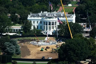 Workers build a helipad on the South Lawn of the White House and continue construction on the new ballroom in Washington on Wednesday. Photo: AP