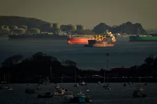 Cargo ships wait to transit the Panama Canal on the Pacific side, in Panama City in March. The Panama Canal will reduce shipping volumes from next month because of a drought fuelled by the El Nino phenomenon. Photo: AFP