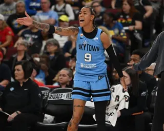 Natasha Cloud gestures with her arm out, shouting animatedly at referees on court