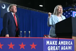 US President Donald Trump (left) listens as White House Press Secretary Karoline Leavitt (right) speaks during a campaign rally at the Myrtle Beach Convention Center in Myrtle Beach, South Carolina, on August 21, 2026. — AFP pic