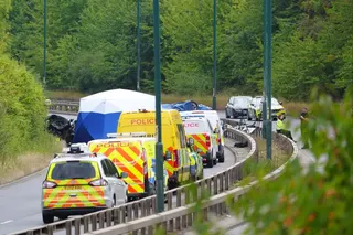 Police officers at the scene of a fatal crash involving a police car and a Volkswagen in South Bank, near Middlesbrough, England, UK on Saturday. Photo: PA via AP