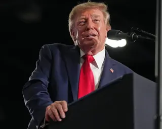 Man leans on podium