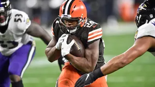 Cleveland Browns running back Nick Chubb (24) rushes for a 7-yard touchdown during the first half of an NFL football game against the Baltimore Ravens, Monday, Dec. 14, 2020, in Cleveland. (AP Photo/David Richard)