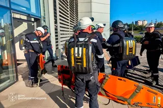 Rescuers at the site of a shopping centre damaged following a Russian strike in Kryvyi Rih on Friday. Photo: AFP
