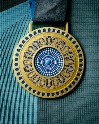 Instagram: sydney_marathon Front of the Sydney Marathon medal.