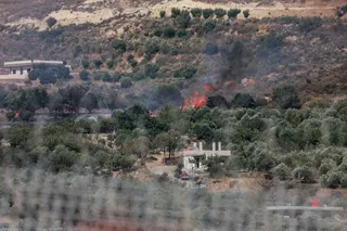A fire is seen on Syrian side, amid the conflict in the Druze areas in Syria, seen from Majdal Shams, near the ceasefire line between the Israeli-occupied Golan Heights and Syria, July 16, 2025 [Ammar Awad/Reuters]