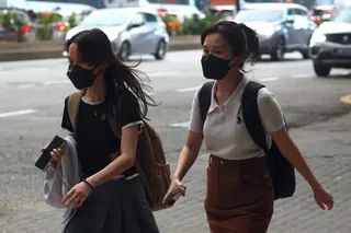 Women wear face masks during haze in Kuala Lumpur, Malaysia, on August 13. Photo: EPA