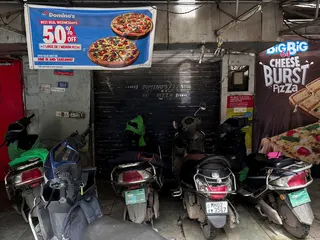 Scooters are parked outside a closed Domino’s Pizza outlet after Maharashtra’s Food and Drug Administration found violations during an inspection in Mumbai, India, on August 14. Photo: Reuters