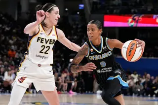 Chicago Sky guard Natasha Cloud, right, drives against Indiana Fever guard Caitlin Clark during the second half of a WNBA basketball game Sunday, Aug. 23, 2026, in Chicago. (AP Photo/Nam Y. Huh)