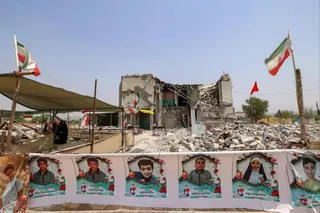 Rubble and portraits of children line the site of the destroyed Shajareh Tayebeh school in Minab, Iran. Photo: AFP