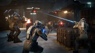Human characters take cover and shoot at a drone while a large robot fires
