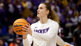 Kate Koval, number 13, warms up before an NCAA Women's Basketball Tournament game.