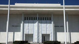A tarp covers parts of the front of the John F. Kennedy Center for the Performing Arts.