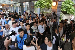 Chief Executive John Lee arrives at Un Chau Estate in Cheung Sha Wan. Photo: Karma Lo