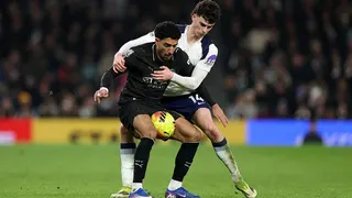 Omar Marmoush of Manchester City holds off
