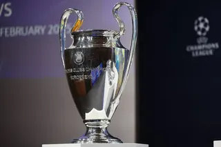 The Champions League trophy is displayed.