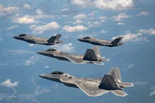 Two US Air Force F-22 fighter jets (front) fly with two South Korean Air Force F-35As during a joint air drill ion May 16, 2024. Photo: South Korean Defence Ministry/AFP