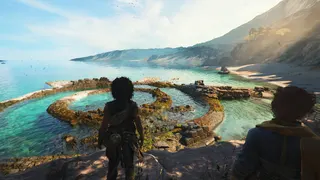 Resonance: A Plague Tale Legacy screenshot showing Sophia and Leni looking towards a shoreline on a Minoan island. The sea is invitingly blue.