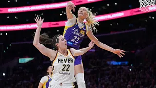 Los Angeles Sparks forward Cameron Brink blocks a shot by Indiana Fever guard Caitlin Clark during a basketball game
