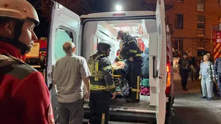 Rescuers evacuate a wounded person from an apartment building hit by a Russian missile strike, amid Russia's attack on Ukraine, in Kyiv, Ukraine August 20, 2026. Picture taken with a mobile phone. REUTERS/Stringer