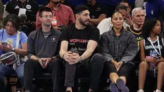 Enes Kanter Freedom looks on courtside during a Chicago Sky and Indiana Fever basketball game.
