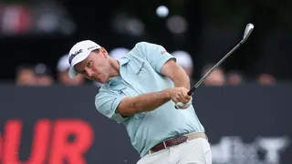Russell Henley hits a tee shot on the 11th hole during the 2025 TOUR Championship at East Lake Golf Club in Atlanta, Georgia.