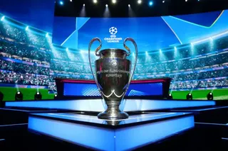 The UEFA Champions League trophy is displayed at the draw in Monaco