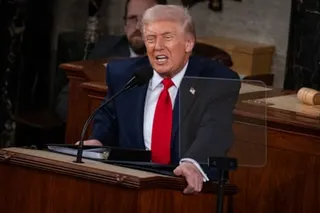 Donald Trump speaks at a lectern.