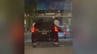 Screenshot showing a group of men performing dangerous stunts along Jalan Sungai Besi. - PIC FROM SOCMED