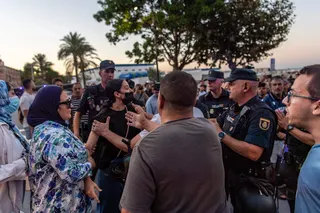 Residents arguing with police on Aug 28, near a demonstration against the presence of migrants in Spain’s north African enclave of Ceuta.