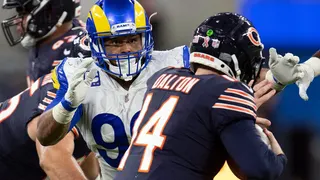 FILE- In this Sunday, Sept. 12, 2021, file photo, Los Angeles Rams defensive end Aaron Donald (99) tackles Chicago Bears quarterback Andy Dalton (14) during an NFL football game in Inglewood, Calif. As Donald, now 30, closes in on the franchise's career sacks record this week, the three-time NFL Defensive Player of the Year says the only difference in his game with age is the recovery time necessary for minor injuries. (AP Photo/Kyusung Gong, File)