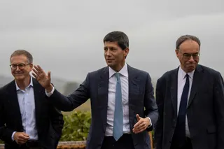 Federal Reserve Chairman Kevin Warsh (centre) waves as he walks with Tiff Macklem (left) Governor of the Bank of Canada, and Andrew Bailey (right) Governor of the Bank of England at the Jackson Hole Economic Symposium August 28, 2026 in Jackson Hole, Wyoming. Bailey had earlier remarked on the consequences of an AI bubble. — Getty Images via AFP