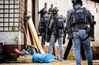 Netherlands' Police Special Intervention Service (DSI) operate during the raid of a vacant home in Nederasselt, south-eastern Netherlands on September 1, 2026, after a shooting that killed one person and injured two police officers.