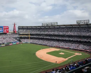 A wide view of packed Angel Stadium with a baseball game in progress on the field